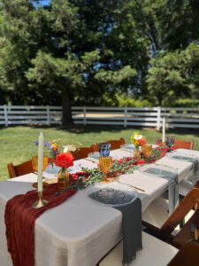 Table set with flowers, candles, glasses, and plates